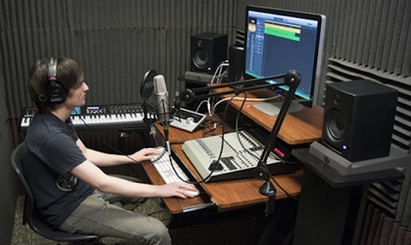 student recording in the audio recording studio