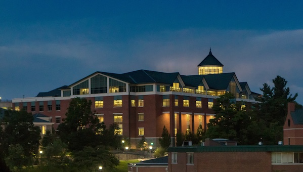 Belk Library exterior view, lit up at night