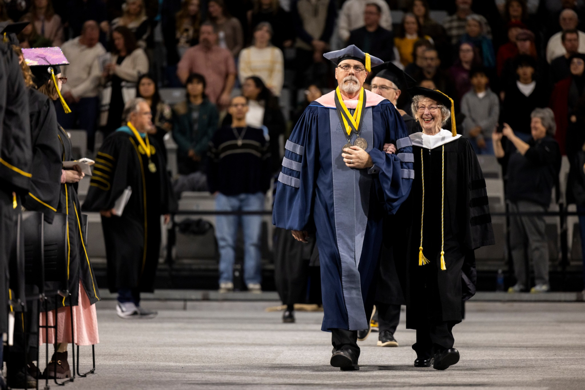 Barbara Freiman and Jobe Bell enter fall 2025 Commencement in Regalia