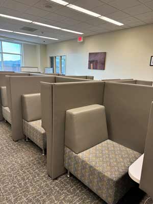 Cubicles with soft seats and built-in desks
