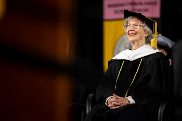 Barbara Freiman seated in App State regalia as she is conferred an Honorary Doctorate