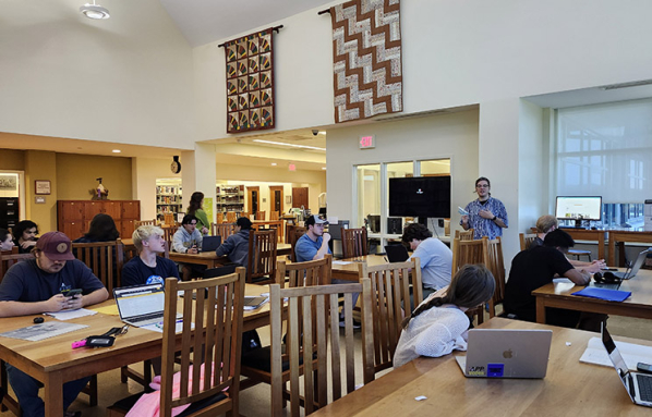Class of students in Special Collections with course instructor Willard C. Watson III