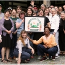 Photo of App State University Libraries faculty members holding a sign with the Information Literacy Basecamp