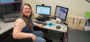 Adelia Daly sitting in front a PC