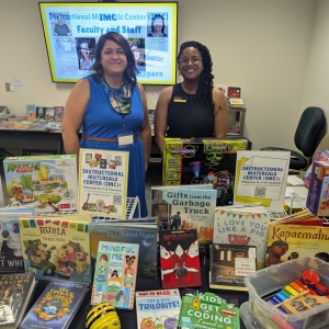 Jenny Coffey and Jewel Davis at Beginner Teacher Summit with books