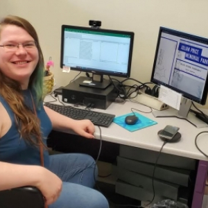 Adelia Daly sitting in front a PC