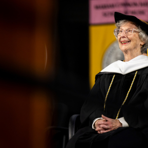 Barbara Freiman seated in App State regalia as she is conferred an Honorary Doctorate