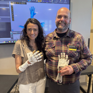 kevin Freeman and Jimena Vergara Sanz pictured holding 3d printed hands