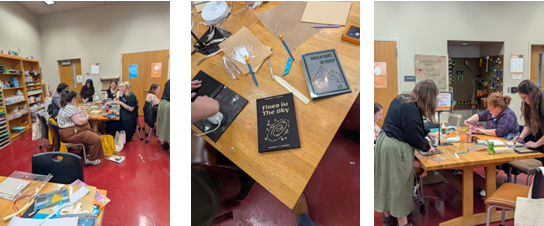 participants crafting custom book covers in a workshop.  covers include Fires in the Sky and When in Doubt Go Higher on black and grey backgrounds
