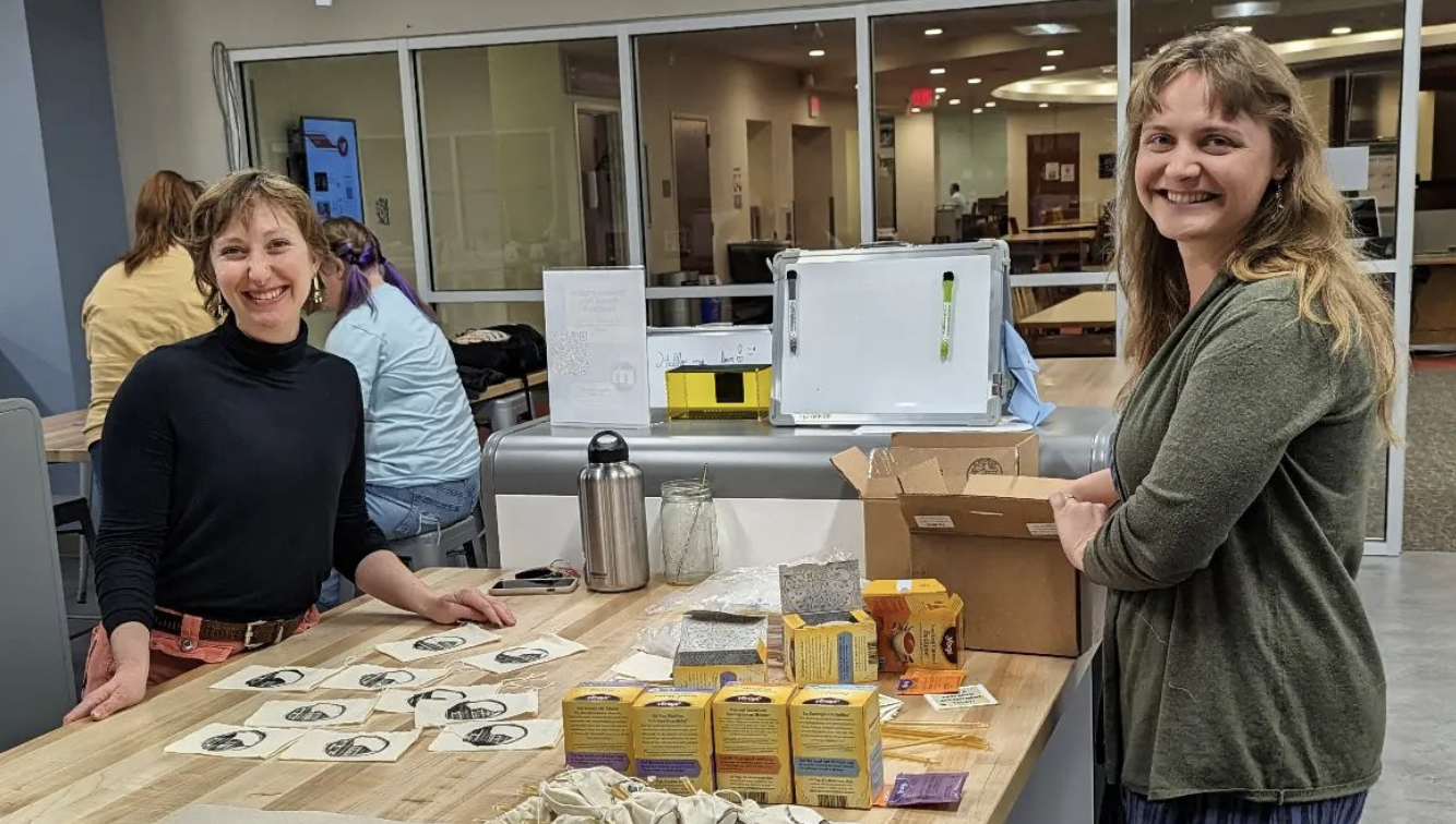Two smiling App State librarians