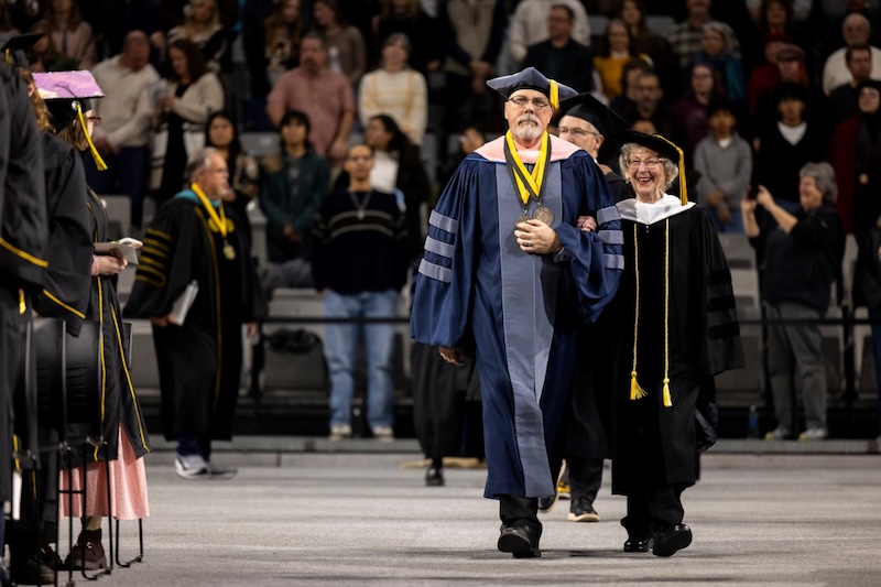 Dr. Jobe Bell and Barbara Freiman in regalia at the Fall 2025 commencement ceremonies