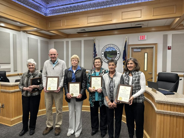 Six winners of the NC Volunteer Service Award holding their framed certificates