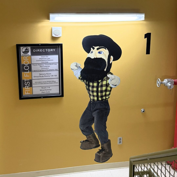 Life size Yosef wall decal and directory sign in the first floor stairwell