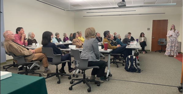 Library Advisory Council Meeting with members watching a presentation